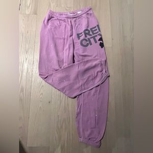 Pink splatter pant free city sweats with tiny stain shown in picture